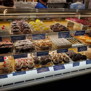 a display case with a variety of pastries