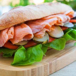 a sandwich with salmon and lettuce