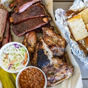 Small Family Meal Plate: Comes w/ Tri-Tip or Brisket (Sundays Only), Chicken, BBQ Ribs, Two Sides, &amp; a loaf of Garlic Bread ($49)