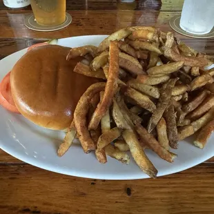 Grilled chicken sandwich. Trust me, it&apos;s there...buried beneath a mound of fresh cut fries