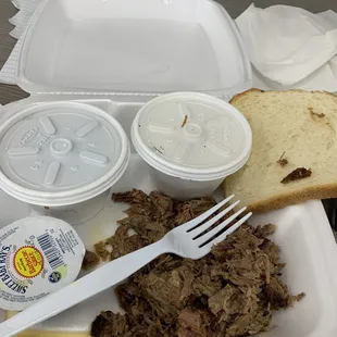 a plate of meat and bread