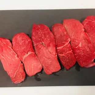 raw meat on a cutting board