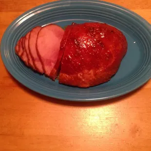 a plate of meat and a piece of ham