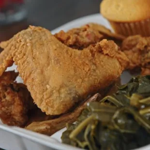 fried chicken, greens, and a muffin