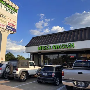 cars parked in front of a restaurant