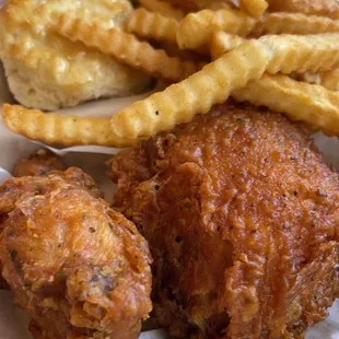 chicken leg and thigh, side of fries and honey glazed biscuit