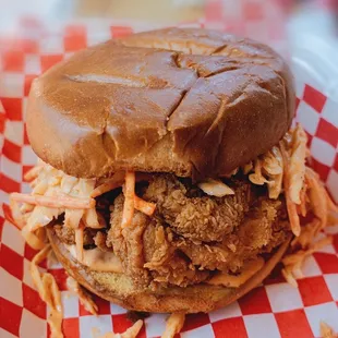 a chicken sandwich with coleslaw