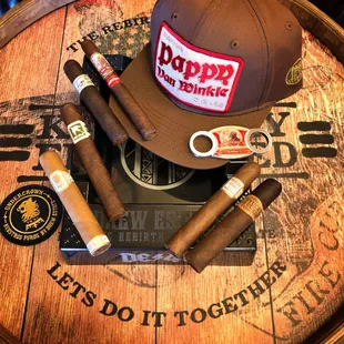 cigars, cigars, and a hat