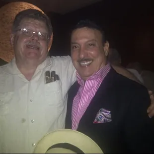 Mike McCoy has been in the cigar business since &apos;84, &amp; has cigars not elsewhere available Pictured: Mike with Carlos Fuente, Jr.