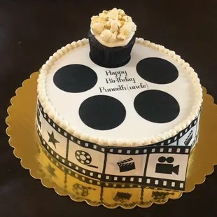 A fun celebration cake ordered for a best friend who is really a film buff.