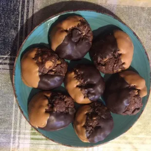 Chocolate chocolate chip cookies dipped in half dark chocolate and half butterscotch.