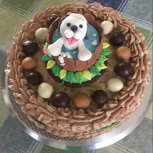 Fondant doggie taking a bath in the whiskey barrel surrounded by assorted chocolate crunch truffles.  Sits on top of a German Chocolate cake