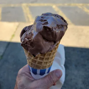 a cone of chocolate ice cream