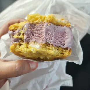 Half eaten ice cream sandwich... loved the black raspberry flavor