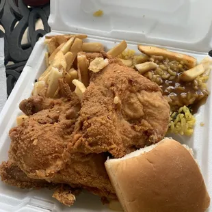 fried chicken and french fries in a styrofoam container