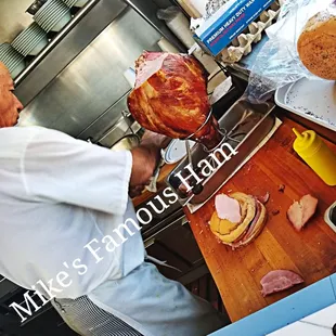 a man holding a ham