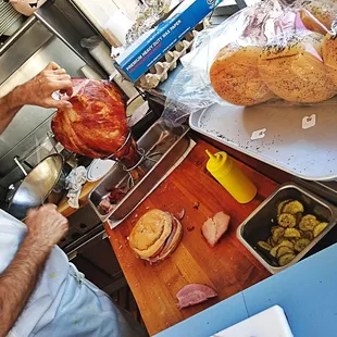 a man preparing a ham