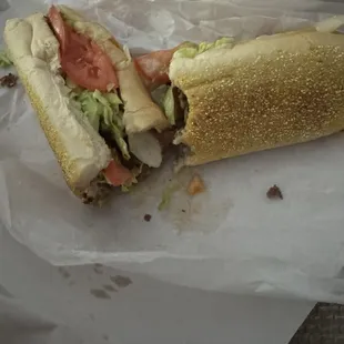 Cheese Steak lettuce ,tomato, sweet peppers, fried onions, mayonnaise and ketchup and American cheese.