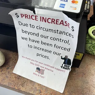 a price increase sign