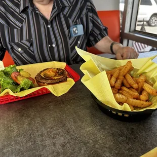 Three-quarter pound burger and fries to share. Look how many fries there are!