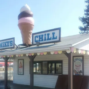 a large ice cream cone on top of a building
