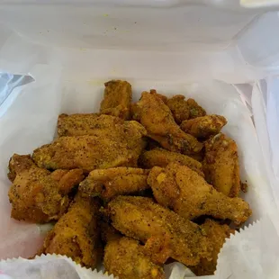 chicken wings in a paper container