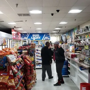two people shopping in a grocery store