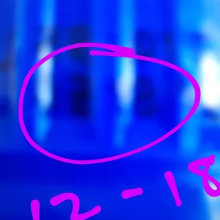 a pink circle with the date 12 - 18 on it