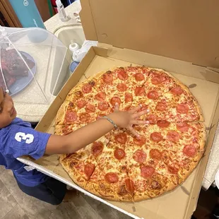 Giant pizza. I believe this is the large size. There&apos;s one more size larger after this.