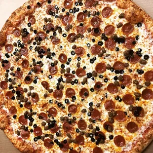 Pepperoni black olives pizza