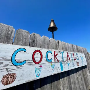 a sign for cocktails