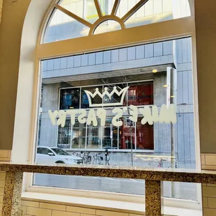 the reflection of a crown on a window