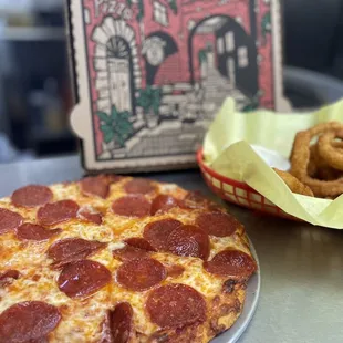 Small thin crust with a side of onion rings