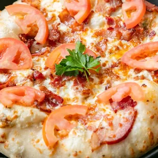 a pizza with tomatoes and cheese