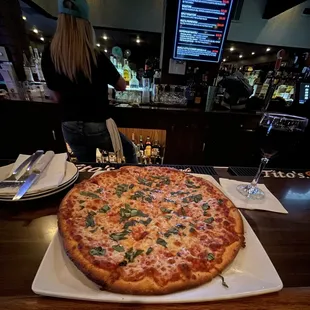 a large pizza on a plate