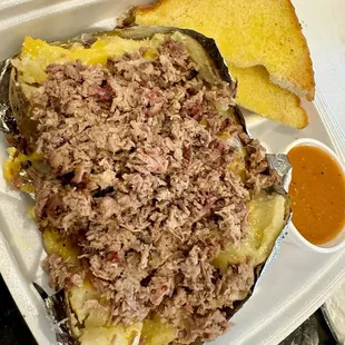 Jumbo baked potato with Brisket.  There's butter, sour cream, and cheese under all the meat!