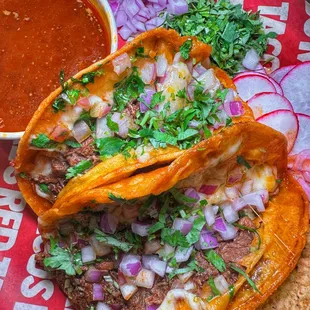 Our famous combo #1: 
2 Birria tacos w/ cheese, side of chips, &amp; side of consome to dip or sip