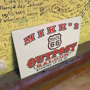 a sign with writing on it