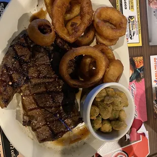 Rancher 's Rib Eye with onion rings and fried okra