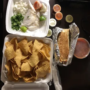 Tacos, chips /salsa and a burrito.