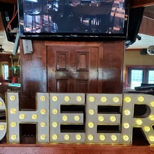 a sign that says cheers