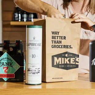 a woman opening a paper bag