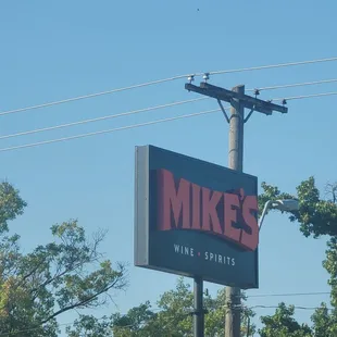 a sign for mike's wine and spirits