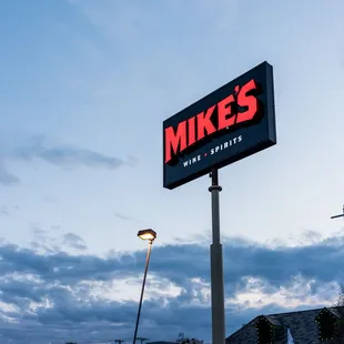 a sign for mike's wine and spirits