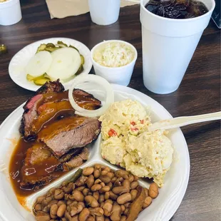 Brisket, potato salad, beans, coleslaw, pickles &amp; onions