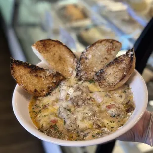 a person holding a plate of food
