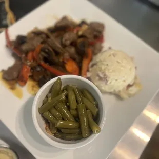 a plate of meat and vegetables