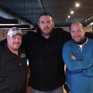 three men posing for a picture