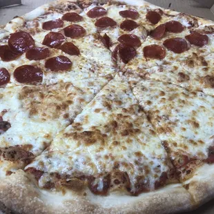 Large half pepperoni, half cheese pie.