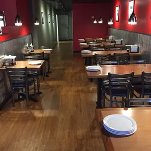 empty tables and chairs in a restaurant